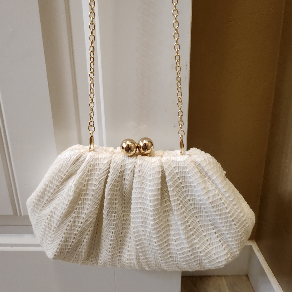 White clutch with detachable gold chain